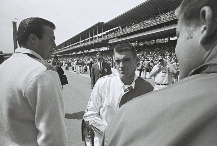 Dave MacDonald and John Mecom talk on the starting grid for the 1964 Indy 500